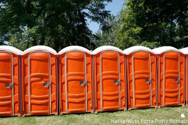 a lineup of clean and well-maintained portable loos for workers in Falls Of Rough, KY