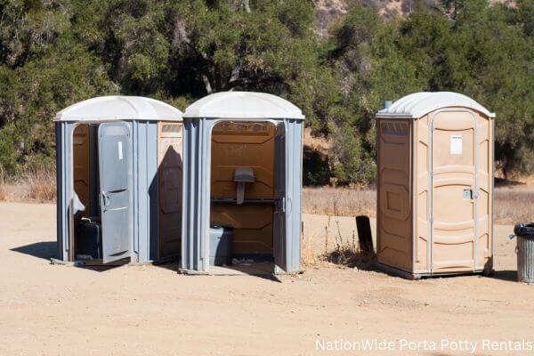 a clean row of portable restrooms for outdoor weddings or festivals in Augusta, KY